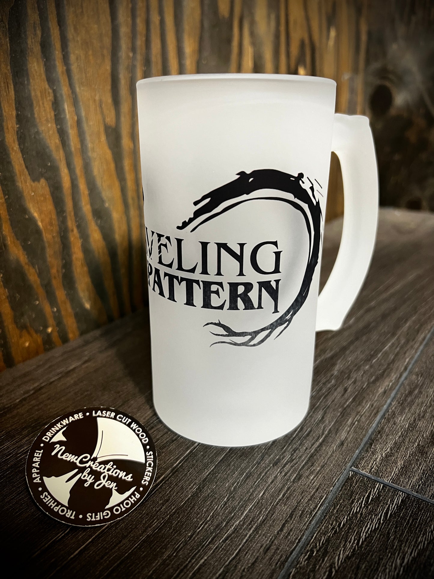 Unraveling the Pattern frosty mug with black dragon logo