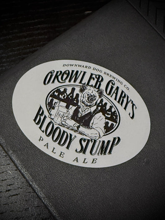 Sticker for 'Growler Gary's Bloody Stump Pale Ale' on a black surface
