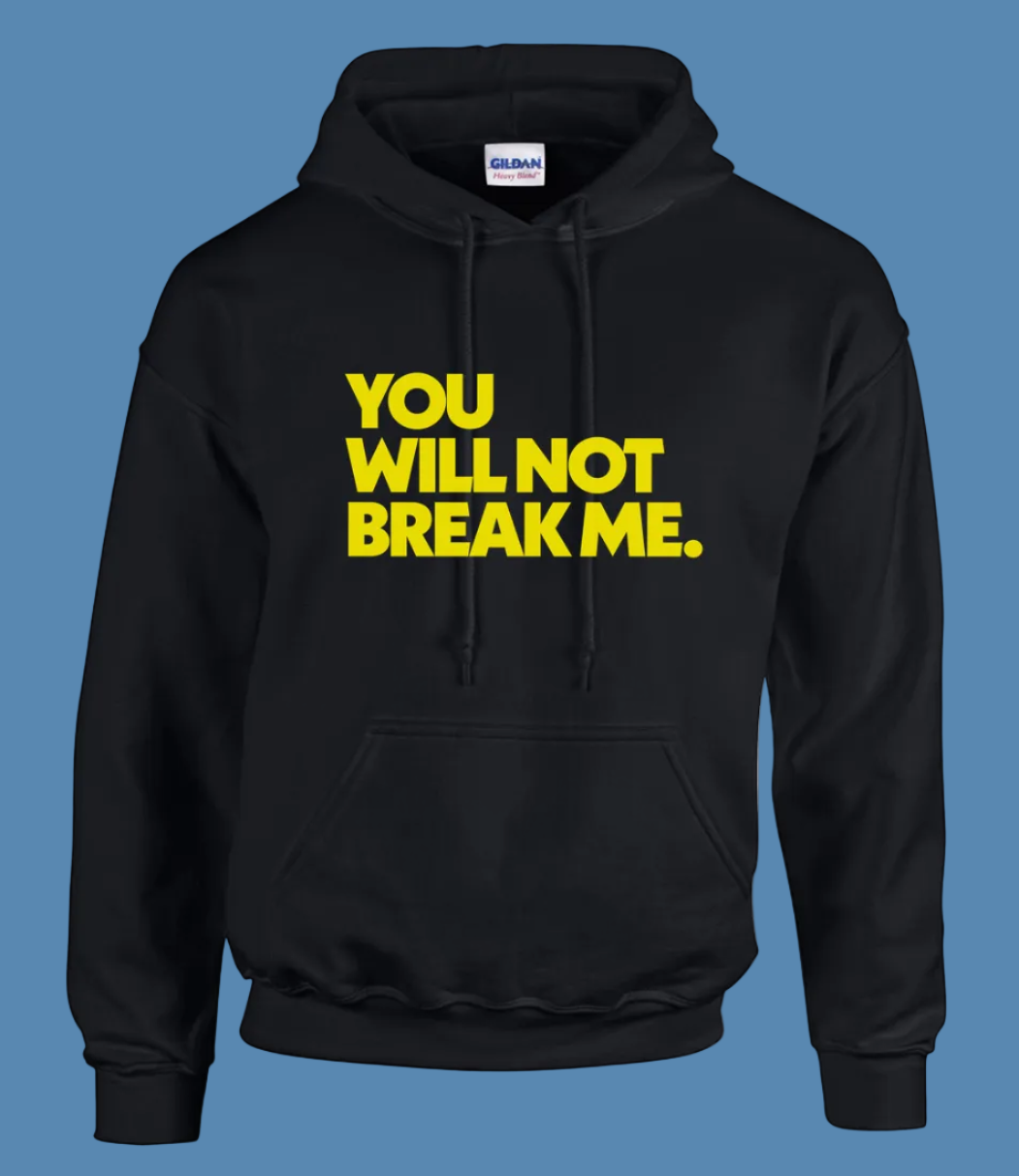Black hoodie with yellow text 'YOU WILL NOT BREAK ME.' on a white background