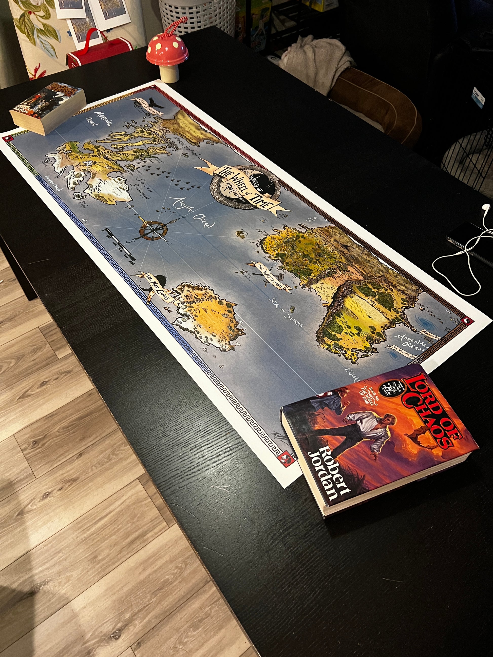 photo of hand drawn wheel of time fantasy map by Illustrator Rob Christianson.