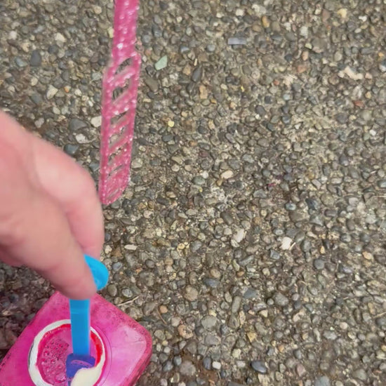 Personalized bubble wand blowing bubbles
